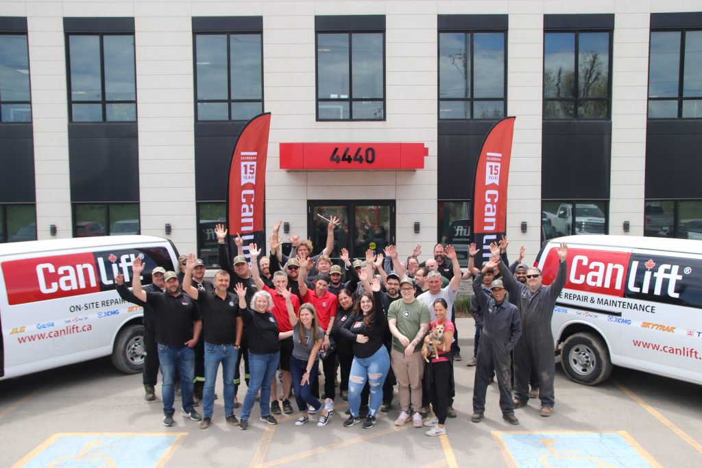 CanLift staff wave in front of their head office in Burlington